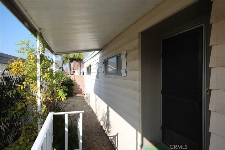 BACK OF PORCH VIEW AND PRIVATE BACK FENCE