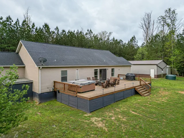 Huge hot tub, Giant Deck with fruit trees adjacent to the home