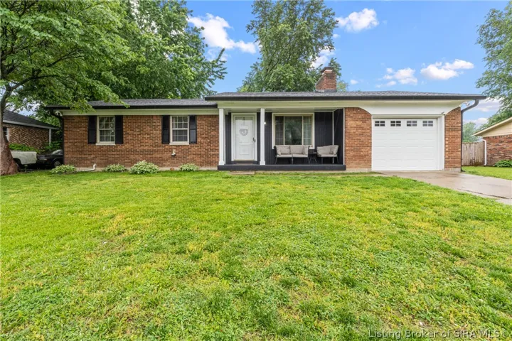 All brick home with garage and fenced yard.