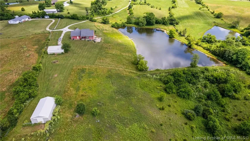 Pond, home, barn and outbuilding and  more!    28 Acres.