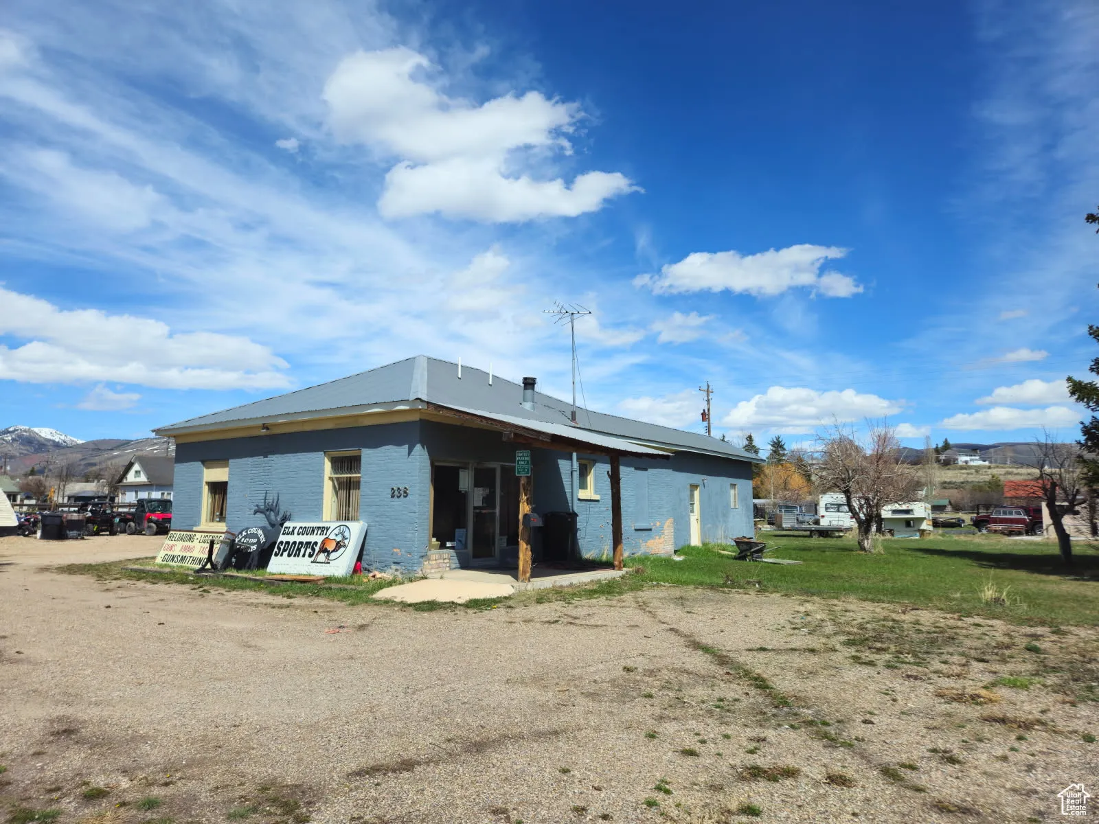 Rear view of house featuring brick siding
