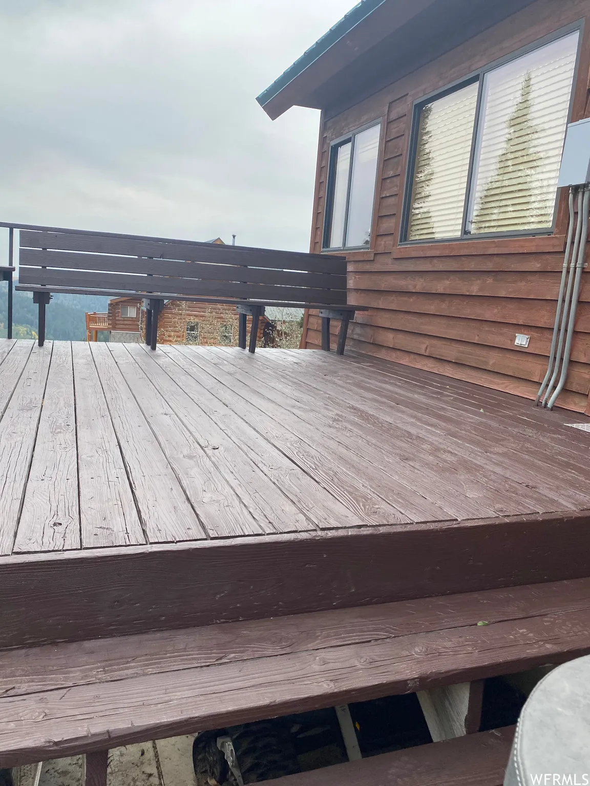 Large deck with carport below