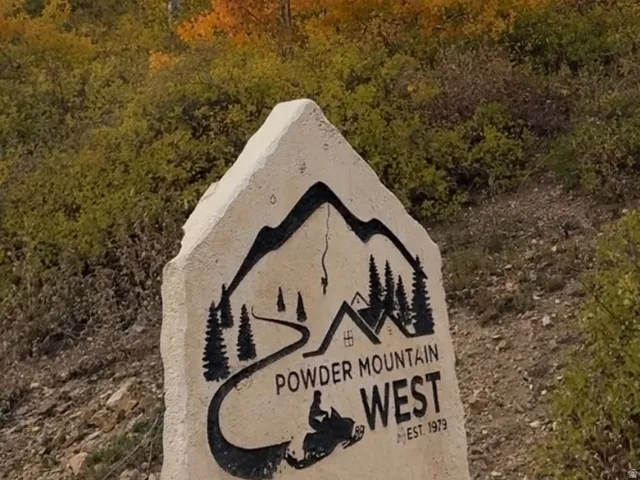 Sculpted stone marker indicating "Powder Mountain West at the gate.53 lots in this subdivision.