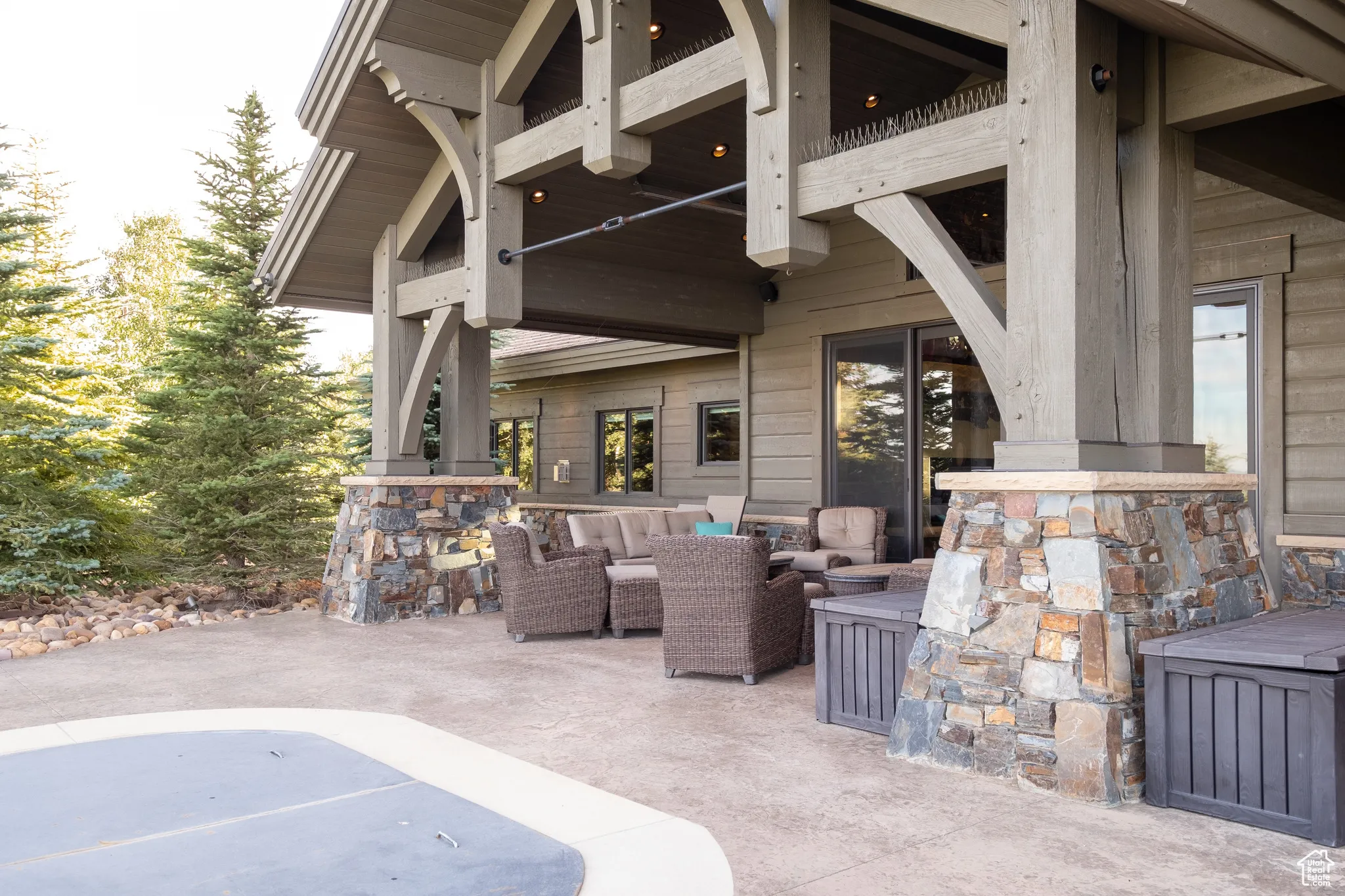 View of patio featuring a balcony and an outdoor hangout area