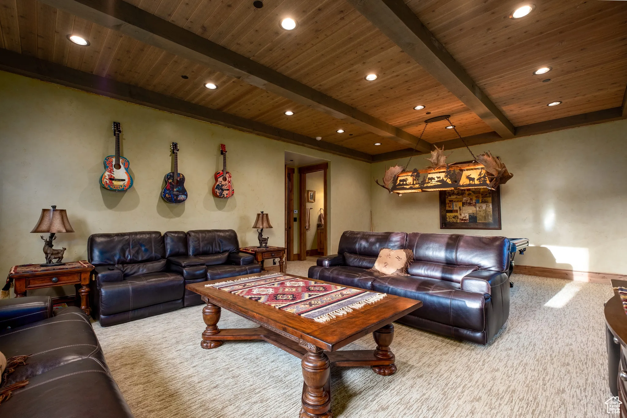 Carpeted living room with wood ceiling, baseboards, beamed ceiling, and recessed lighting