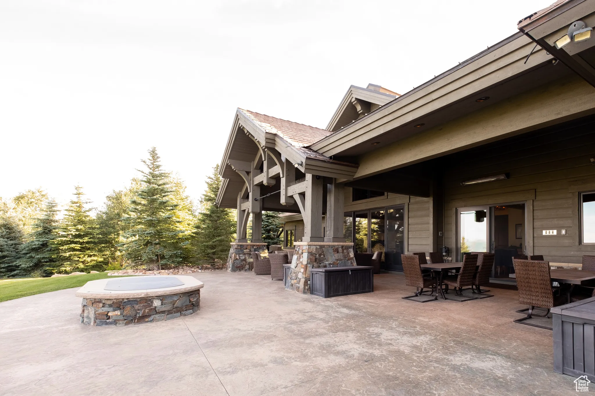 View of patio / terrace featuring outdoor dining area and an outdoor fire pit