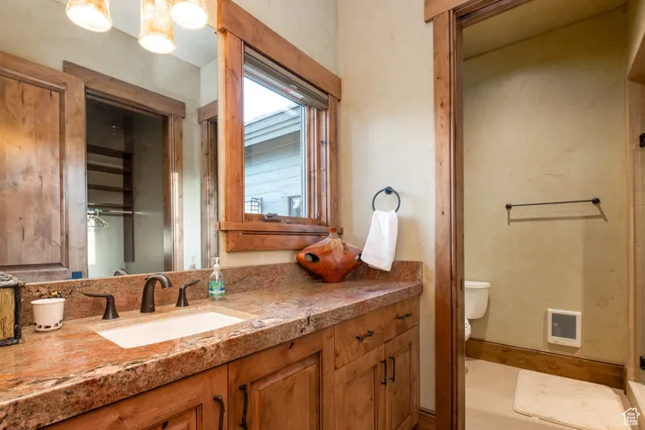 Bathroom featuring vanity and toilet