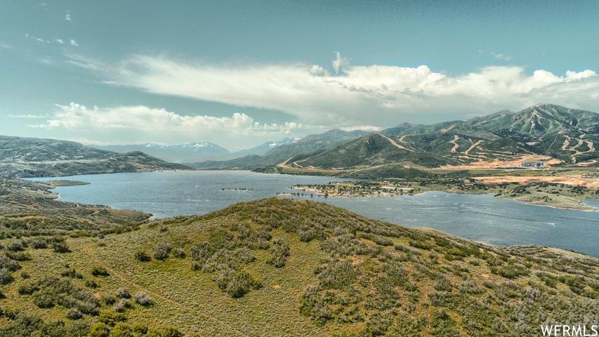 Property view of water with a mountain view