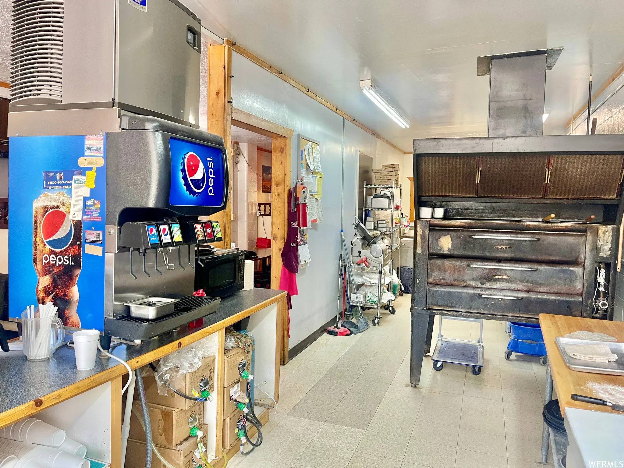 Kitchen with light flooring