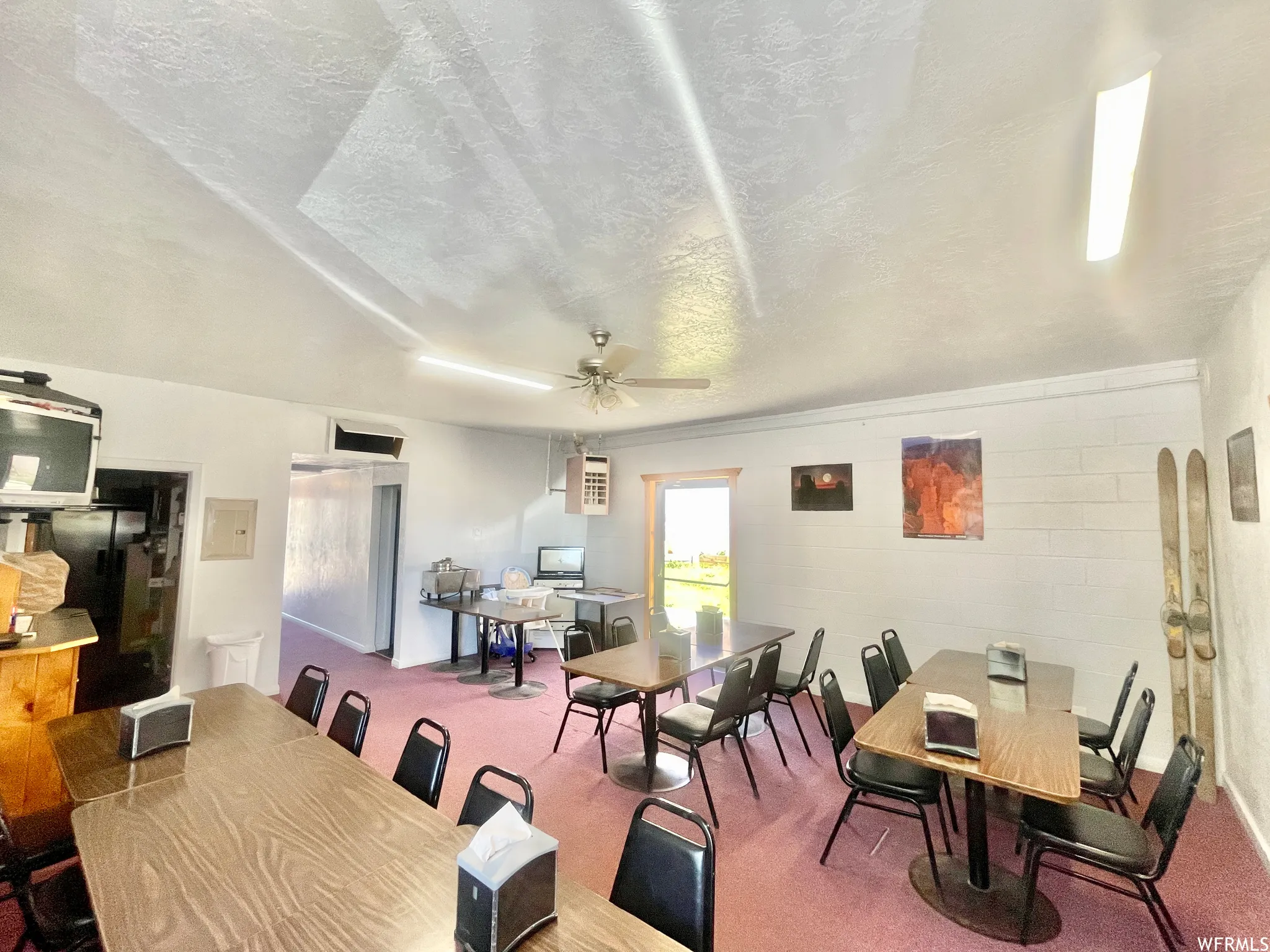 Dining space with a ceiling fan