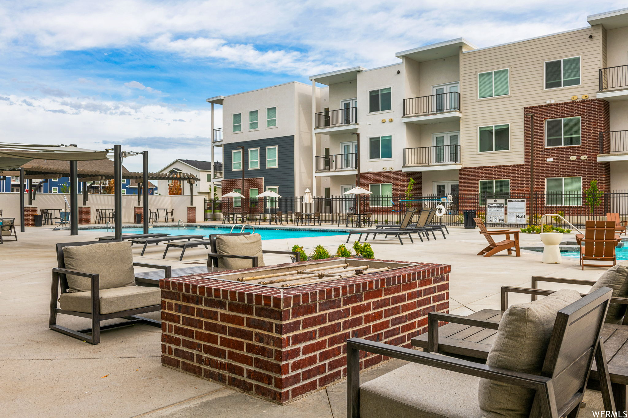 Exterior space with pool and balcony