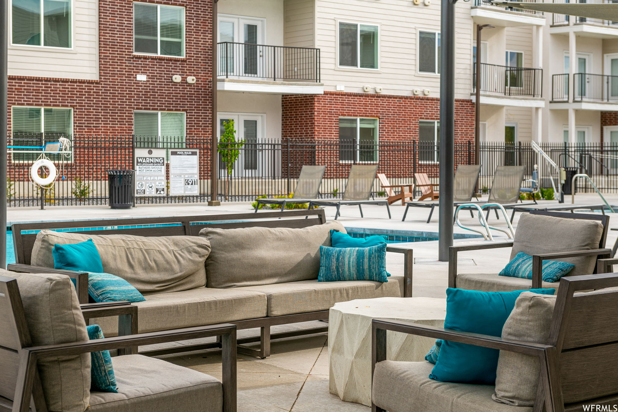 View of terrace featuring balcony and pool