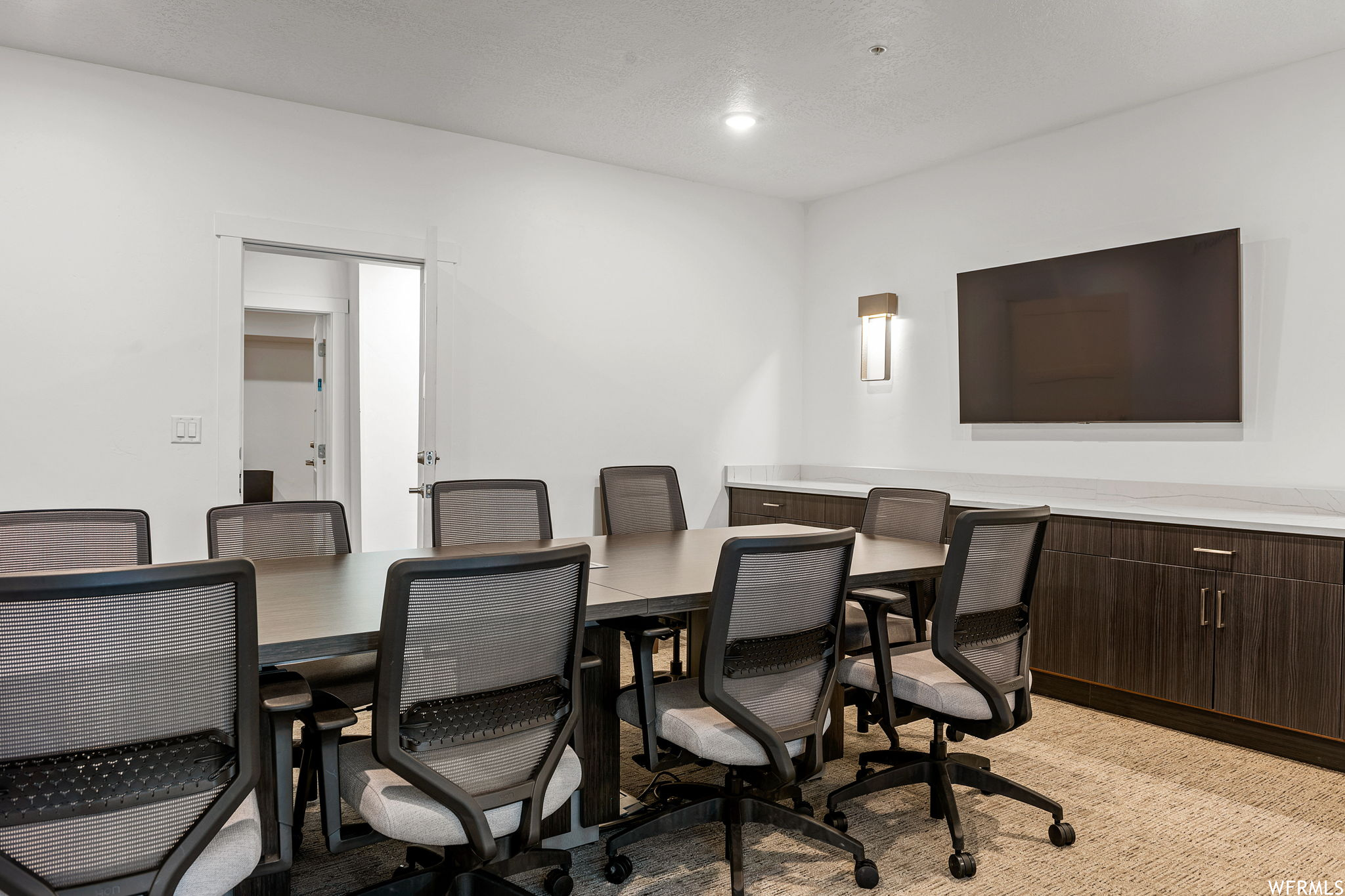 Dining area featuring light carpet
