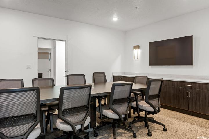 Dining area featuring light carpet