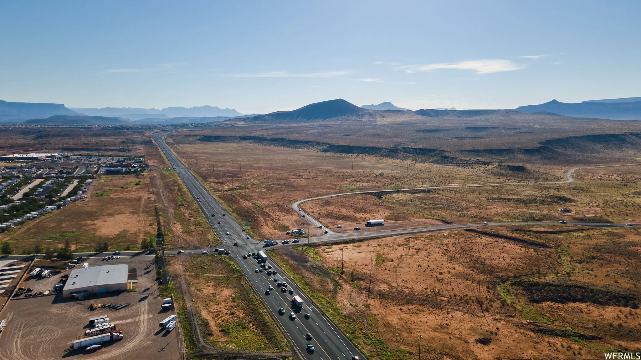Birds eye view of property with a mountain view