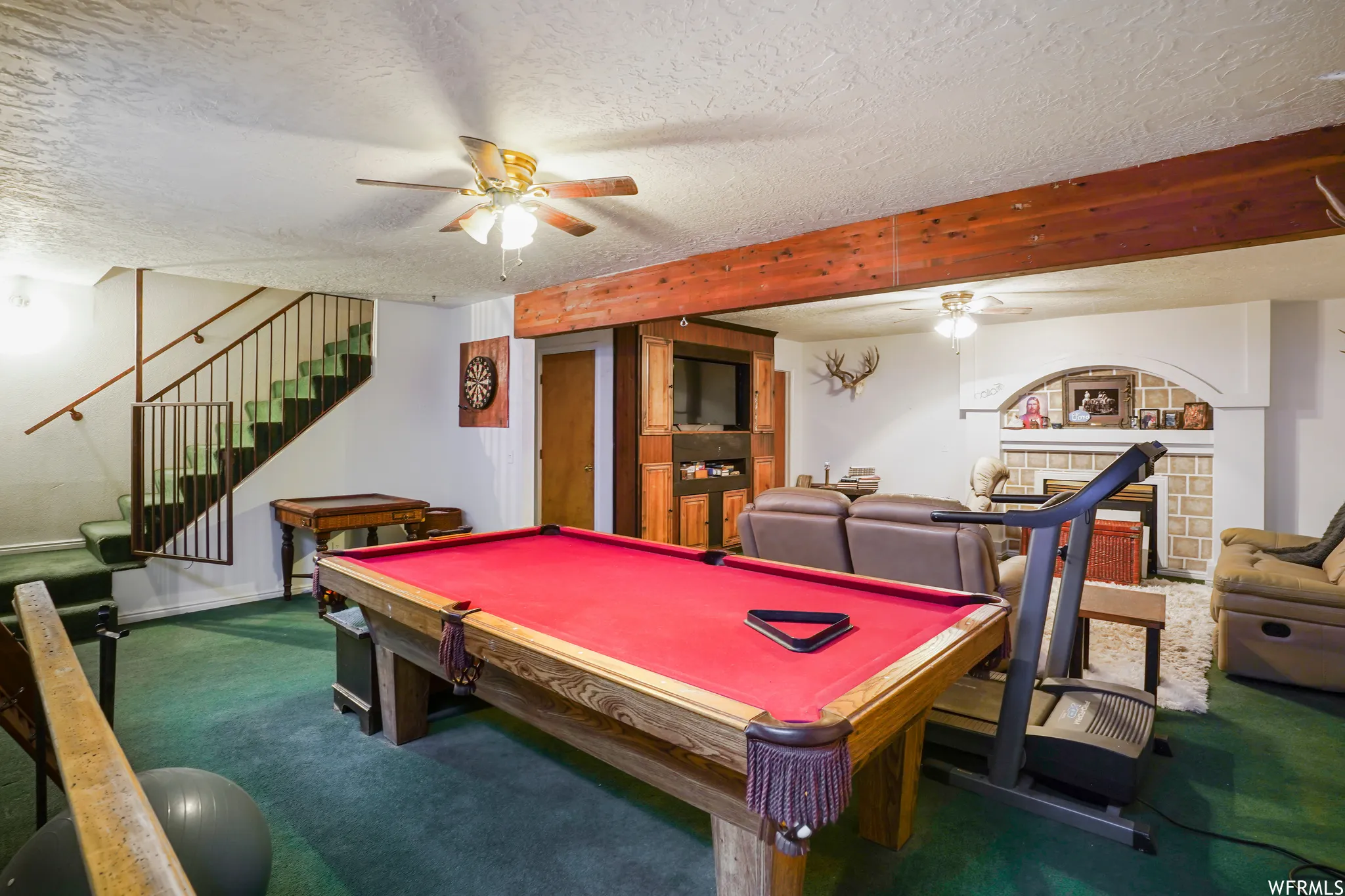 Rec room featuring billiards, ceiling fan, and a textured ceiling