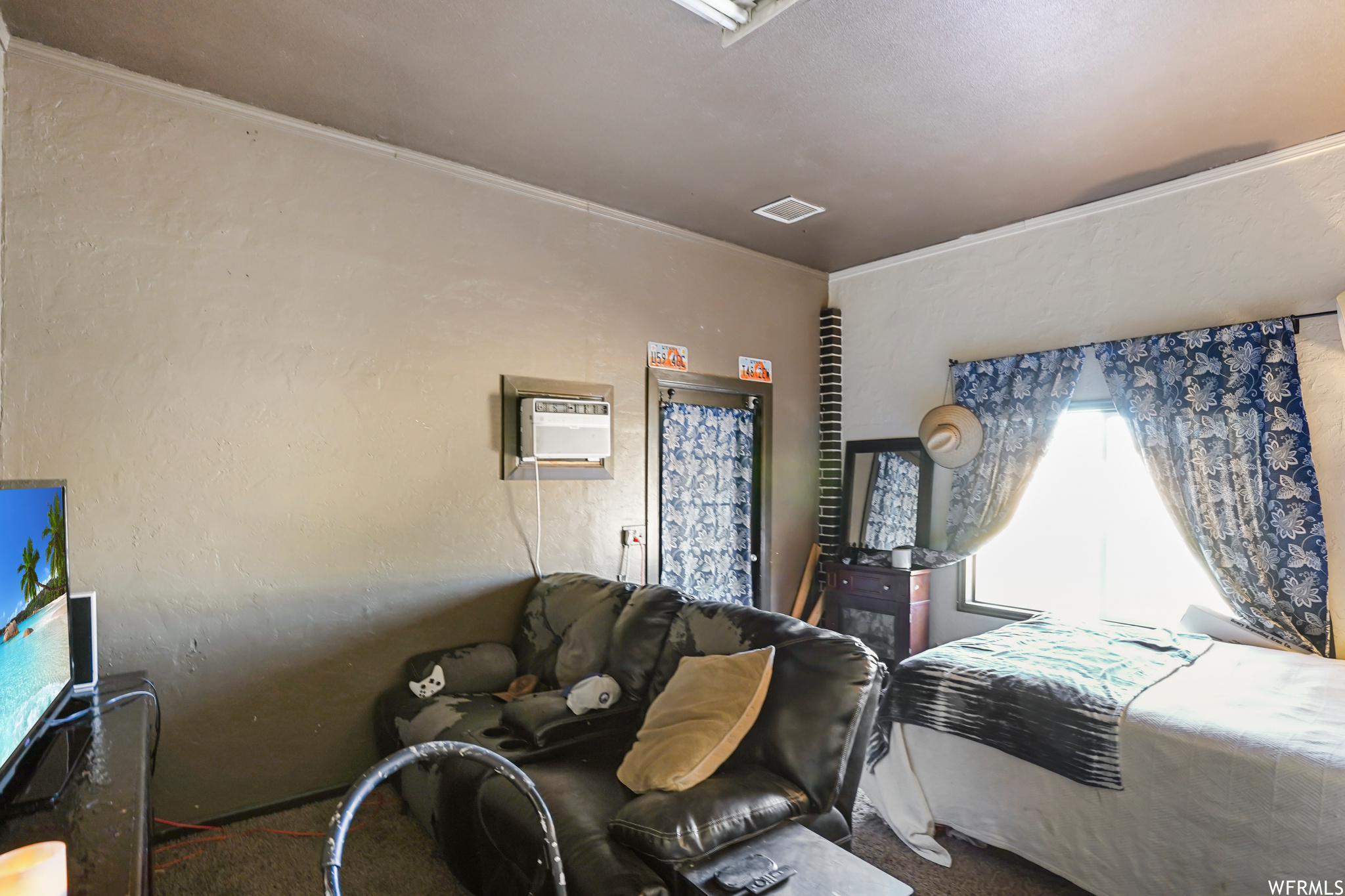Bedroom with an AC wall unit