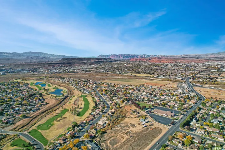 Birds eye view of property with a mountain view