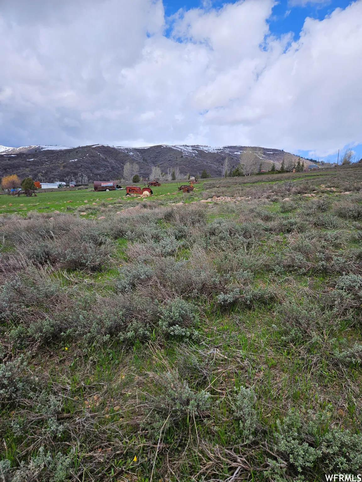 Property view of mountains with a rural view