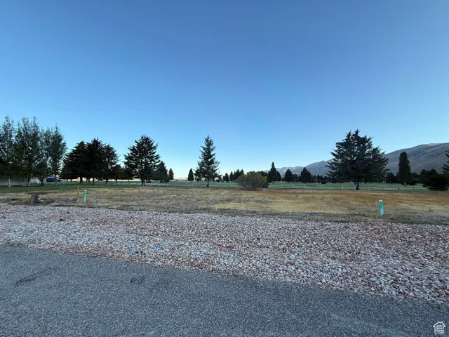 View of yard featuring a mountain view and a view of countryside