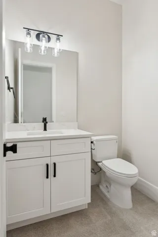 Bathroom featuring vanity and toilet