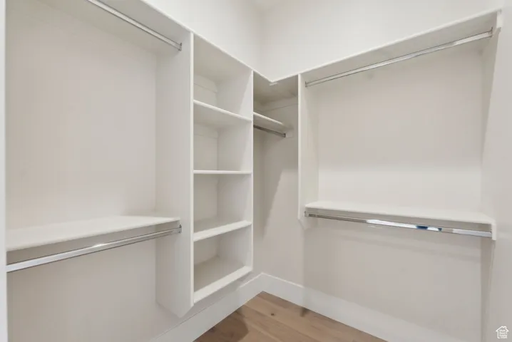 Walk in closet featuring light wood-type flooring
