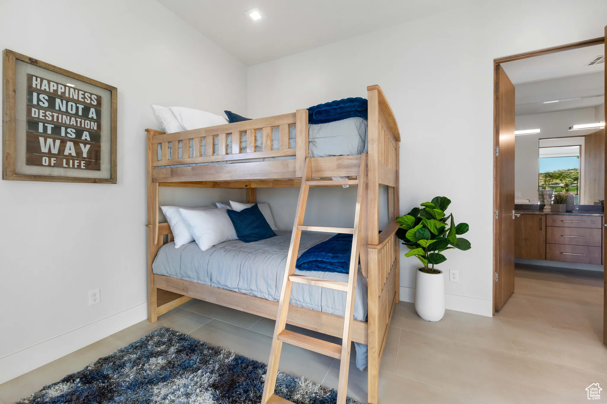 Bedroom featuring light tile floors