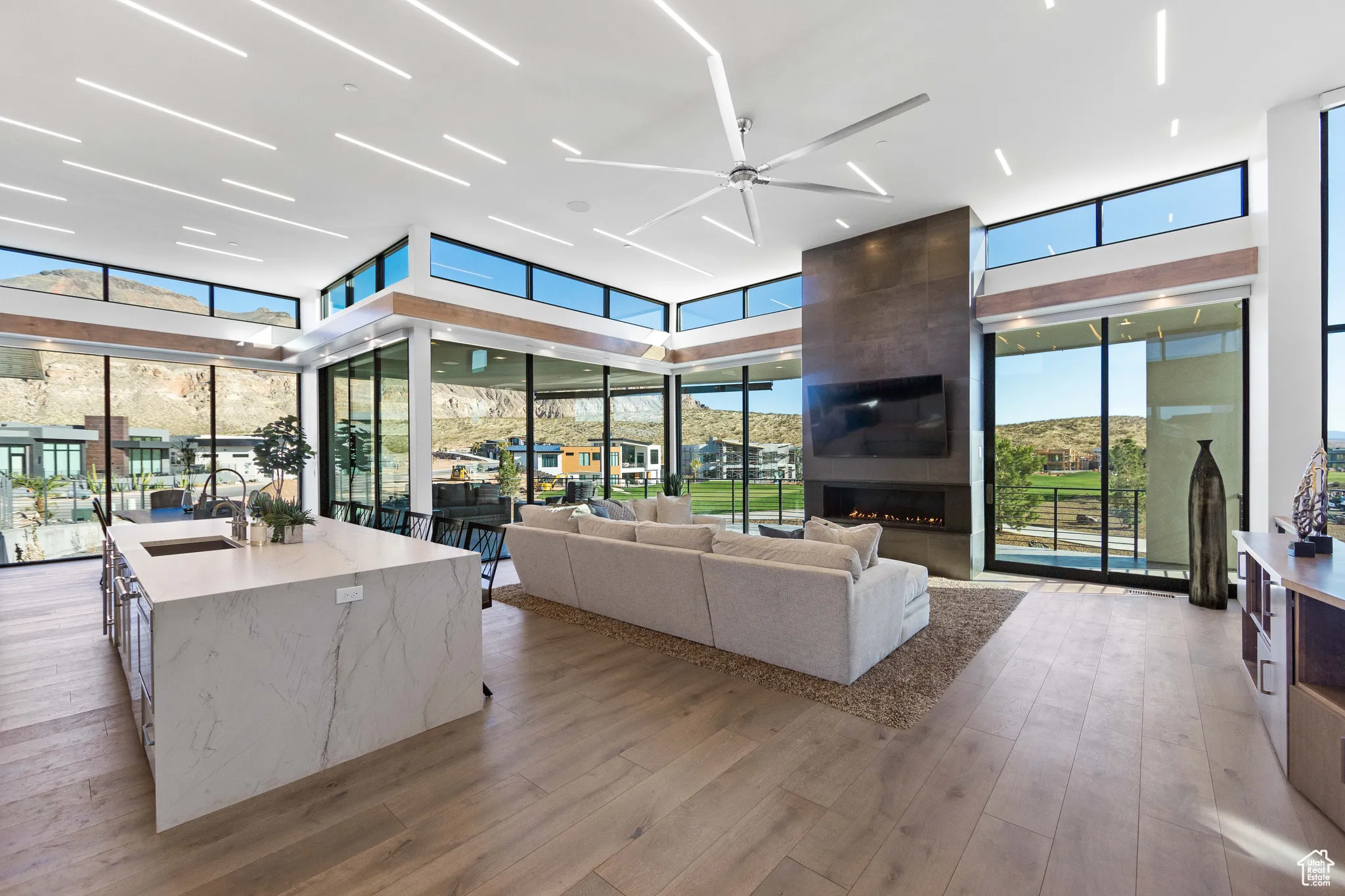 Living room with plenty of natural light and light hardwood / wood-style flooring
