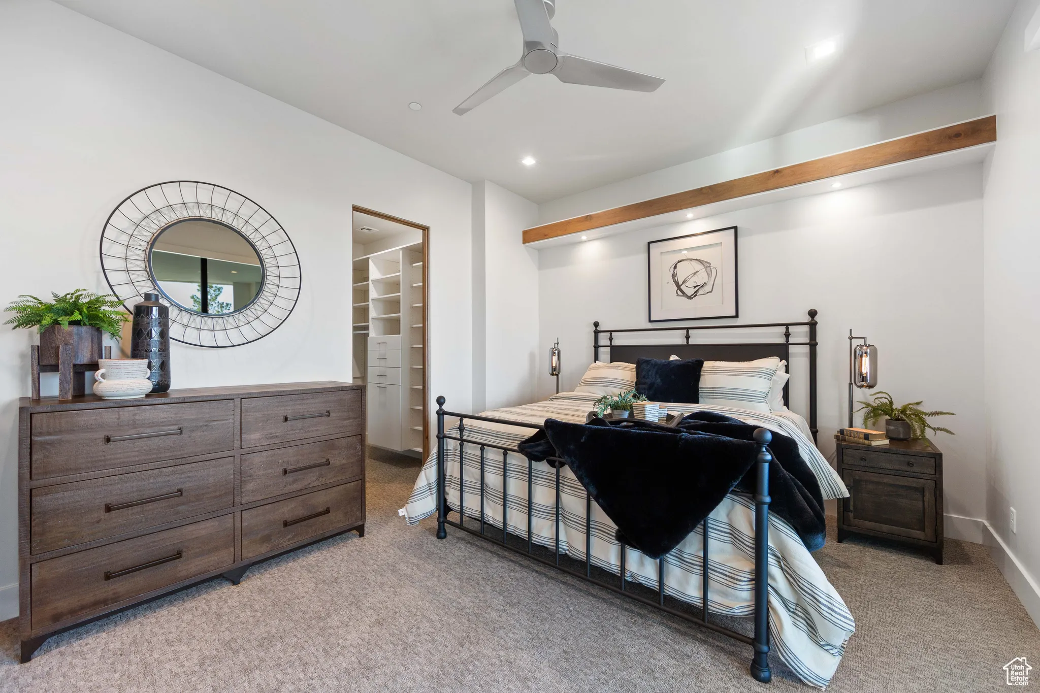 Bedroom featuring ceiling fan and light carpet