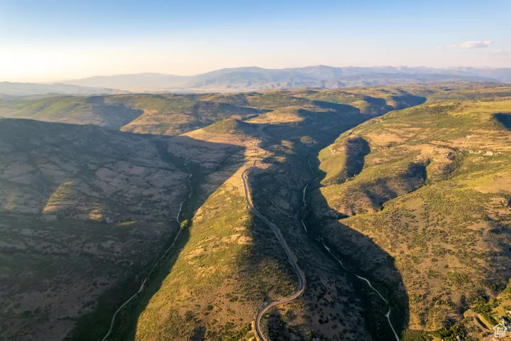 Aerial overview of property's location featuring mountains