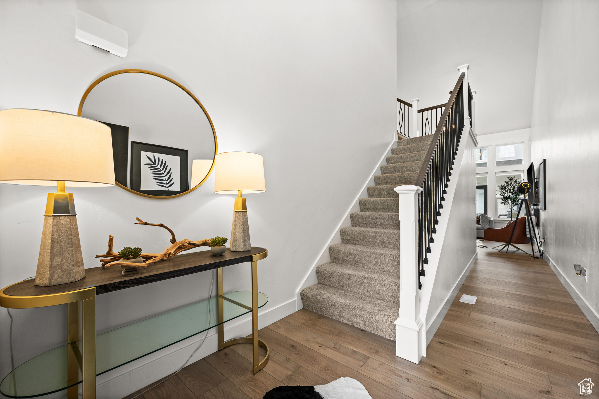 Stairs with light wood-type flooring