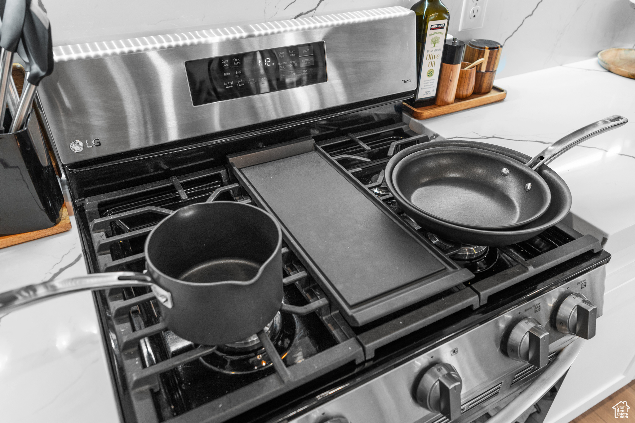 Room details featuring stainless steel electric range