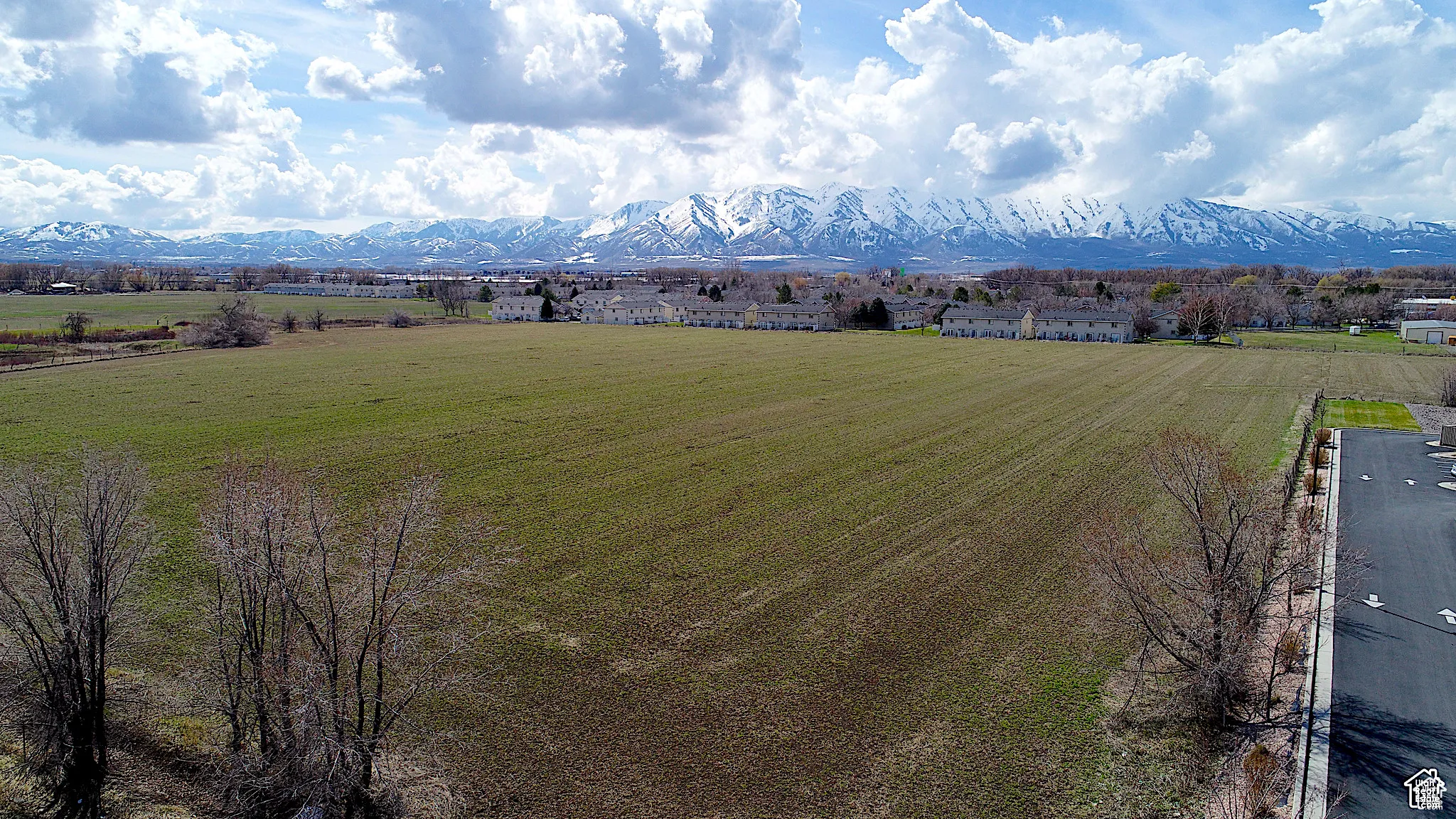 Bird's eye view looking west with view of the Wellsville Mountains along north side of property
