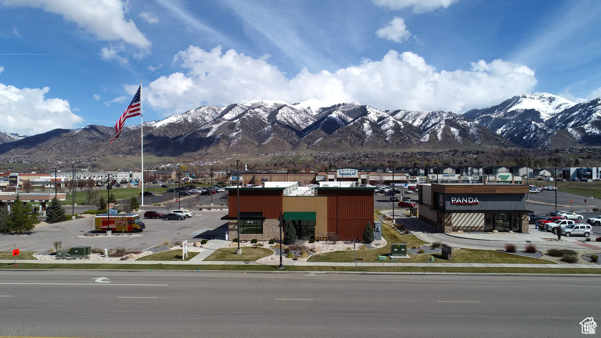 View of busy retail development across highway to the east