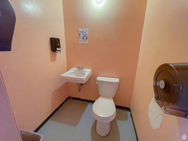 Bathroom featuring sink and toilet