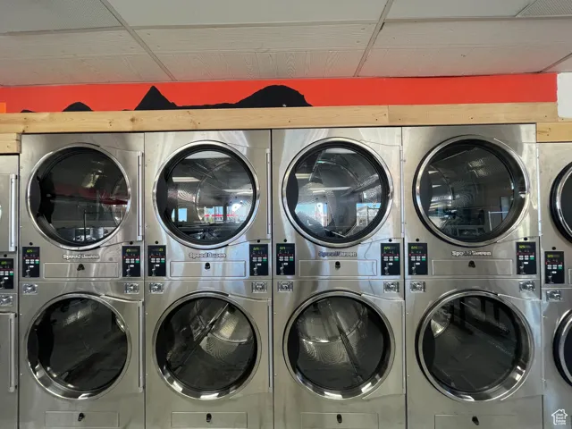 Laundry area with stacked washer / drying machine
