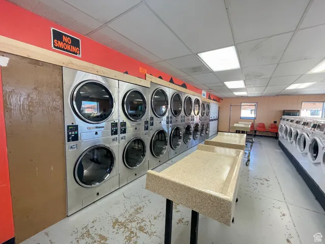 Laundry area featuring stacked washer / drying machine