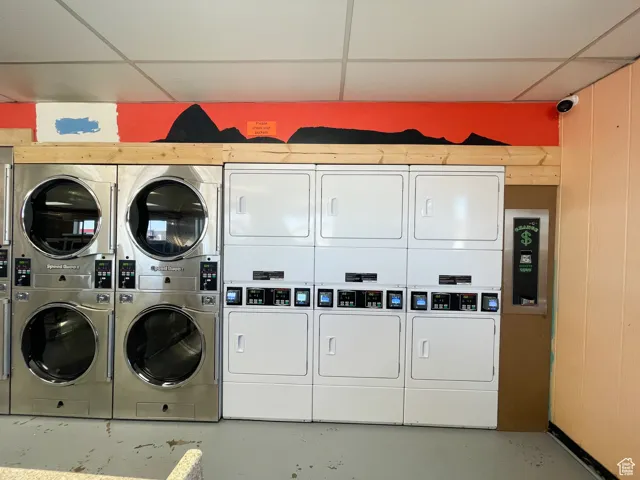 Laundry room featuring washer and clothes dryer and stacked washer / drying machine