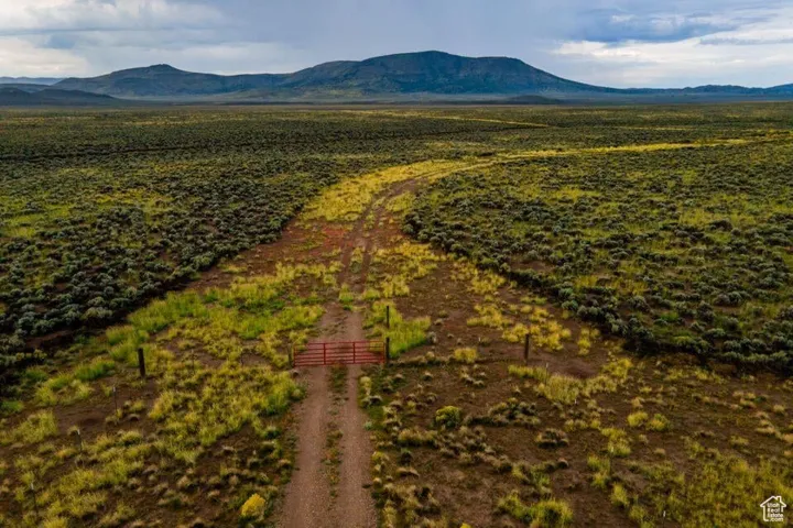 Birds eye view of property featuring a mountain view and a rural view