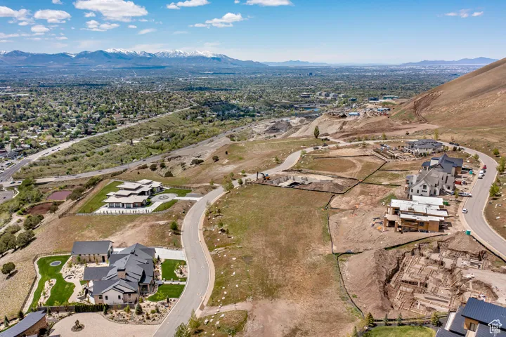 View of property location featuring mountains and nearby suburban area
