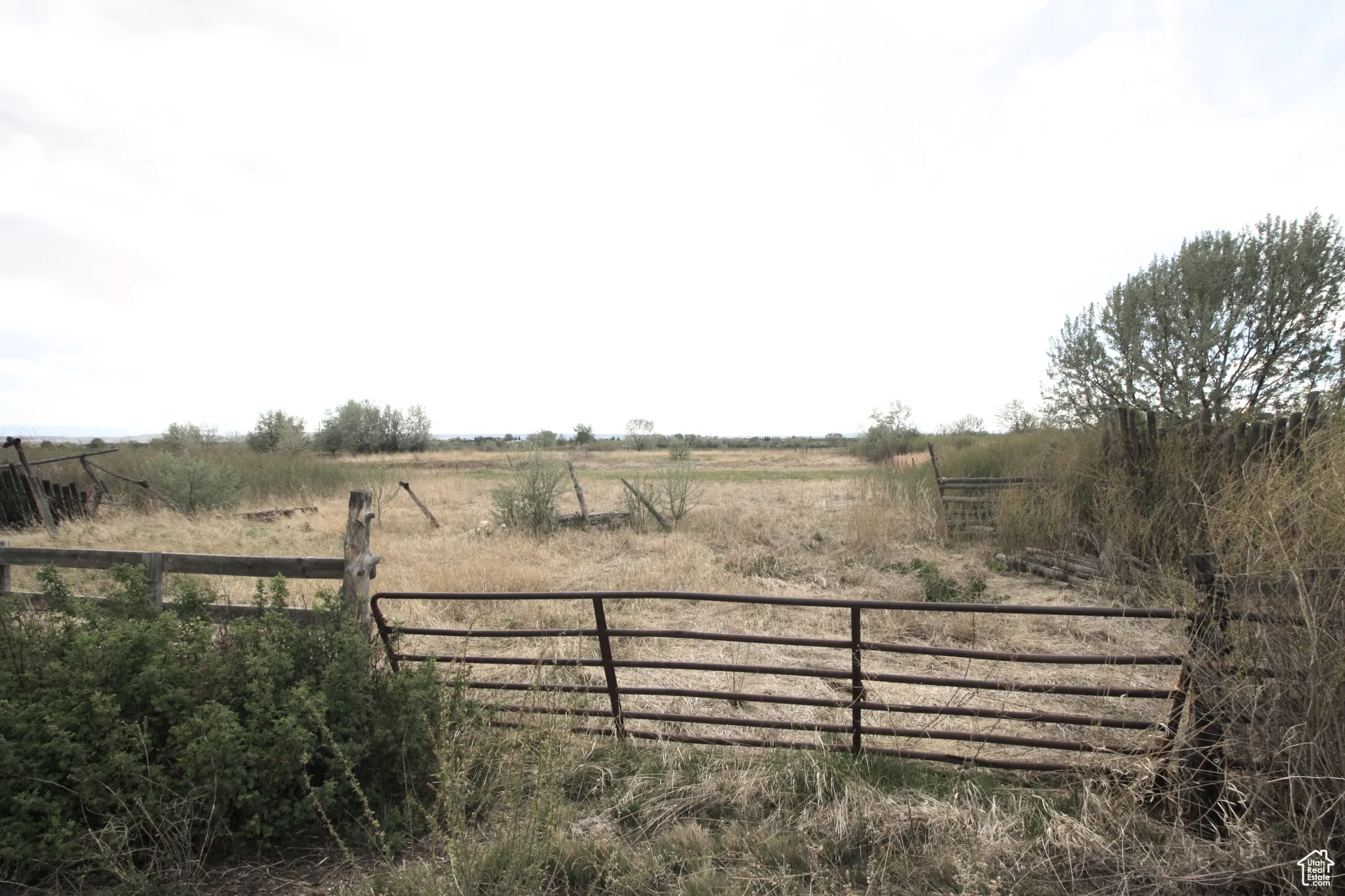View of gate with a rural view