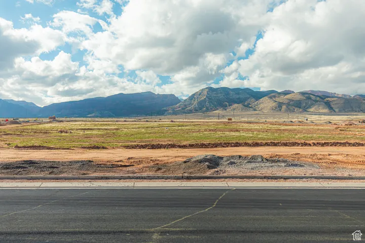 Property view of mountains with a rural view