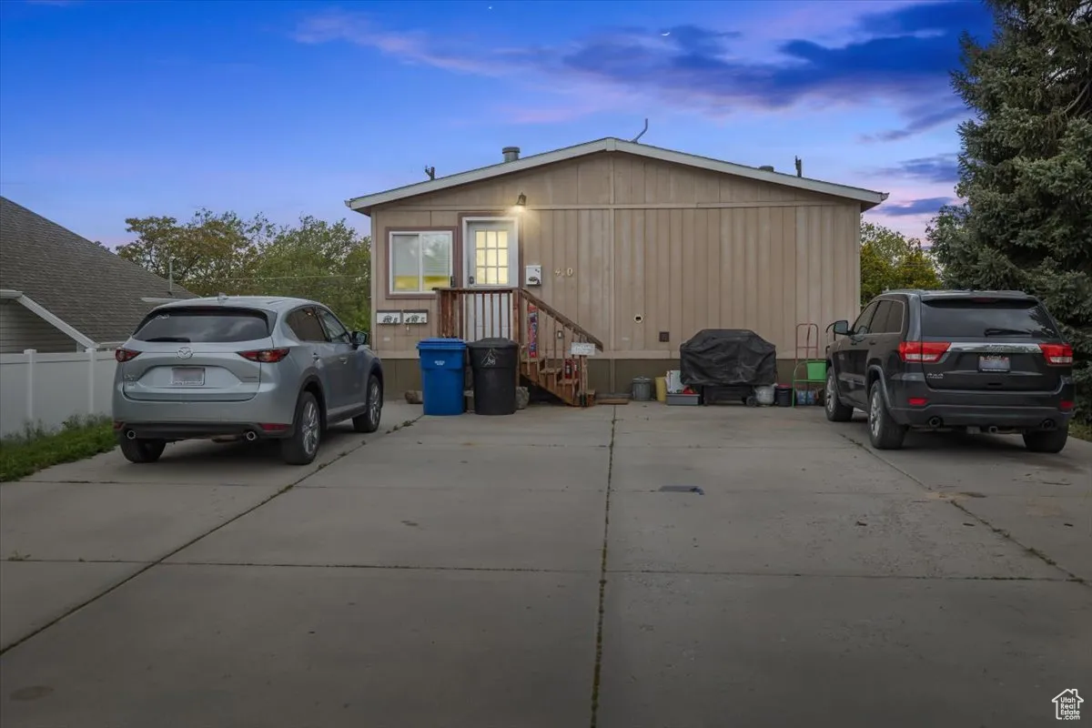View of property exterior at dusk