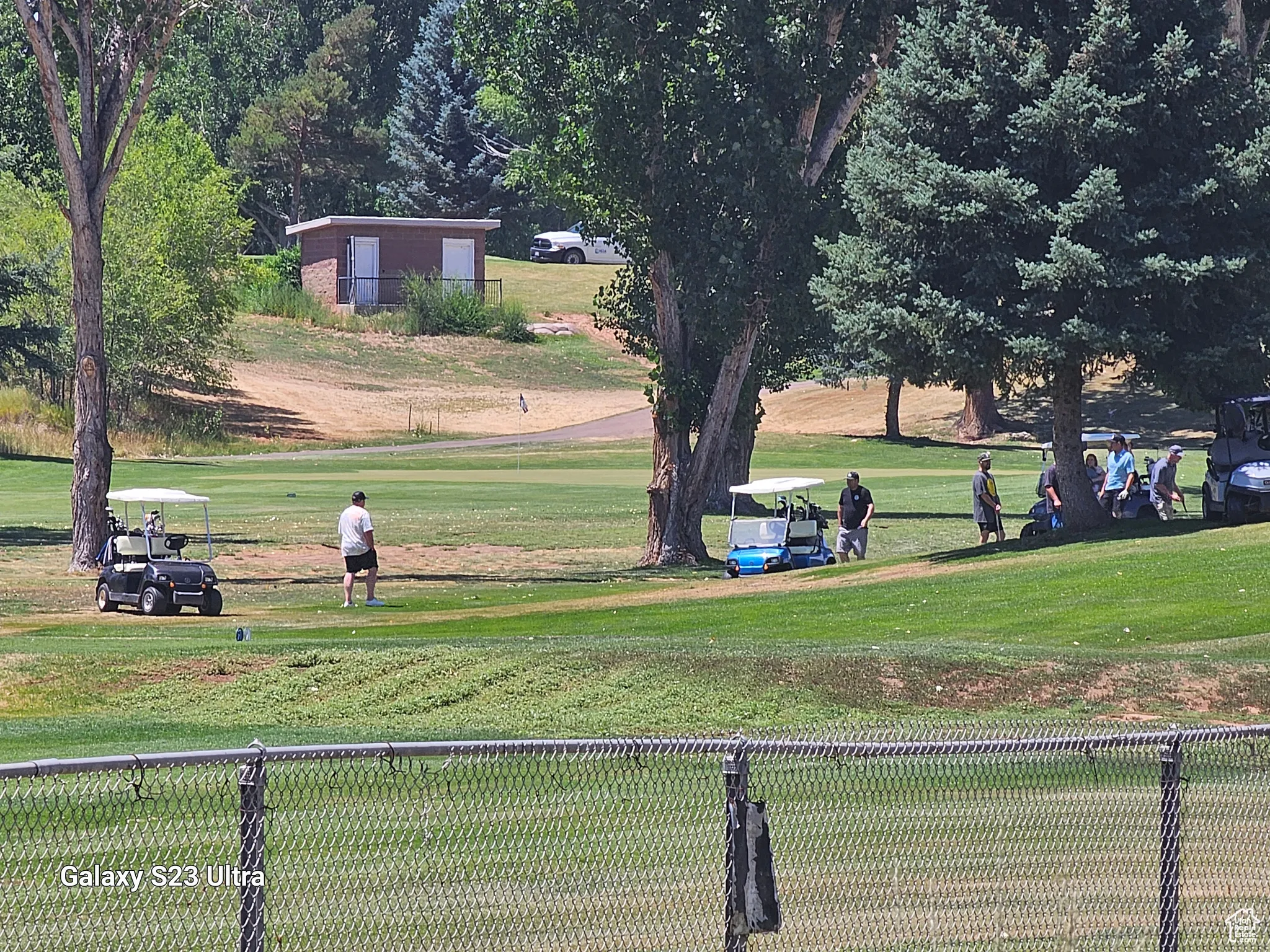 View of property's community with a lawn