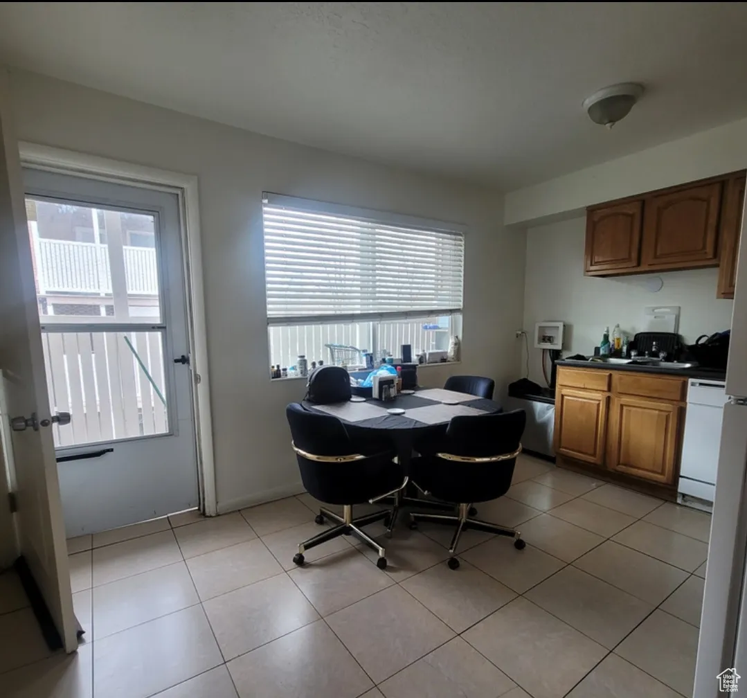 Tiled dining room with plenty of natural light