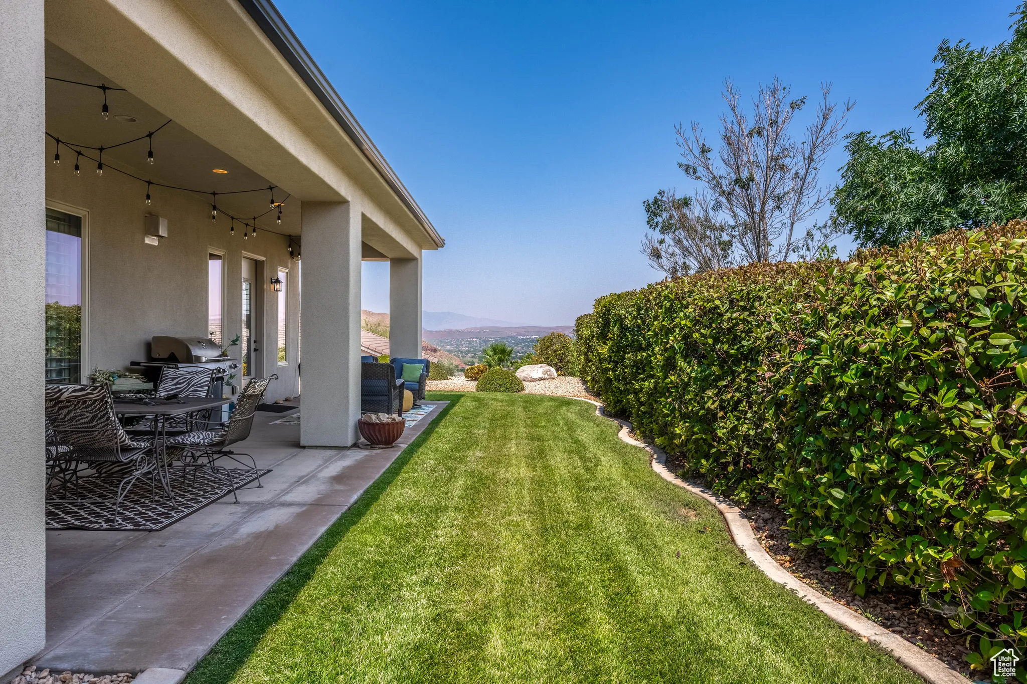 View of yard featuring a patio and a mountain view