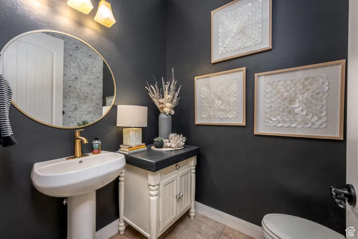 Bathroom with tile patterned floors and toilet