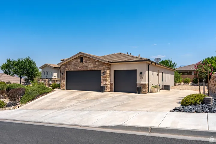Single story home with a garage