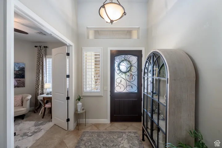 Entrance foyer featuring light tile patterned floors