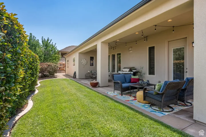 View of yard with an outdoor hangout area and a patio area